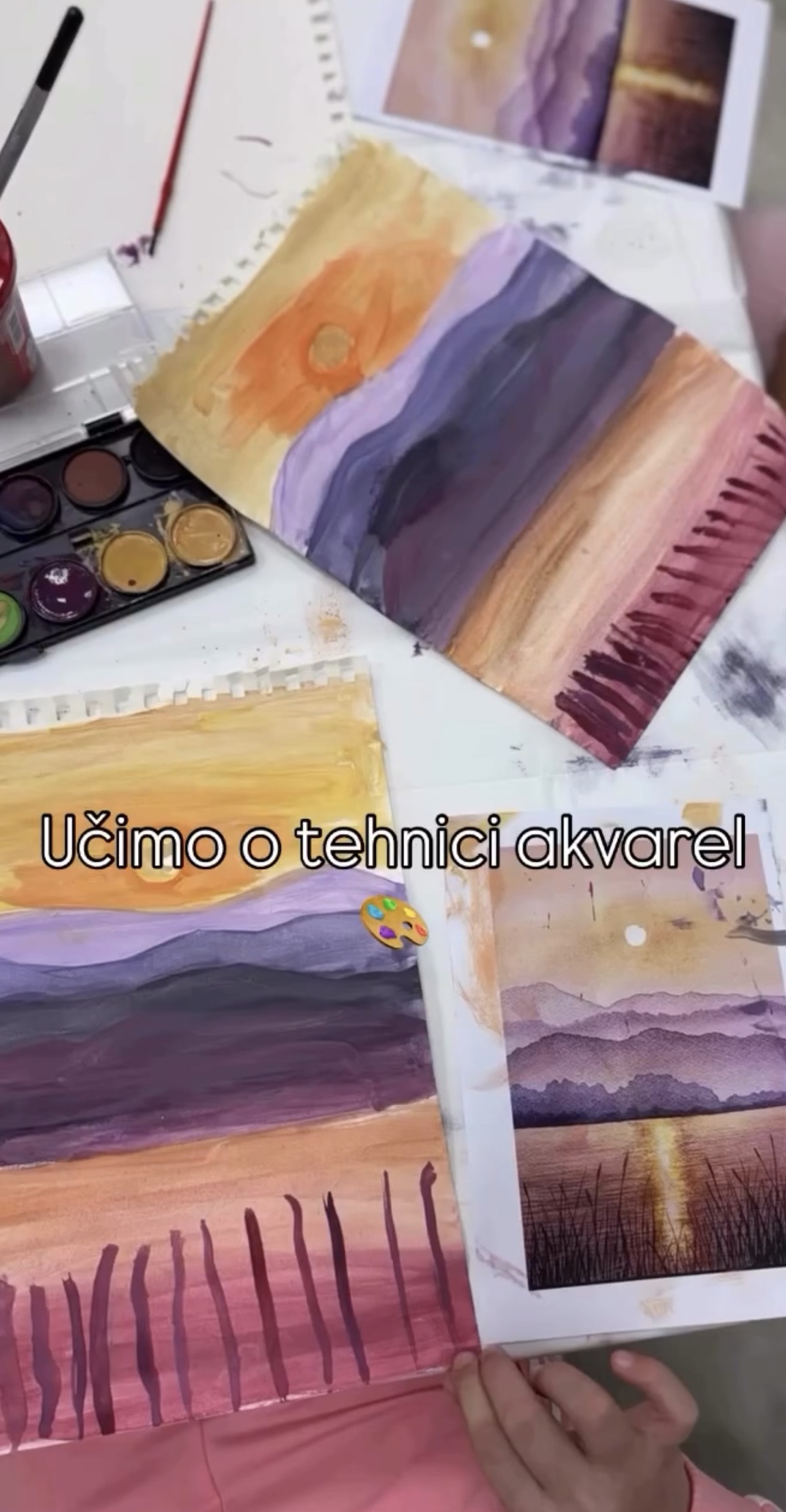 Watercolour studies of sunsets on the worktable